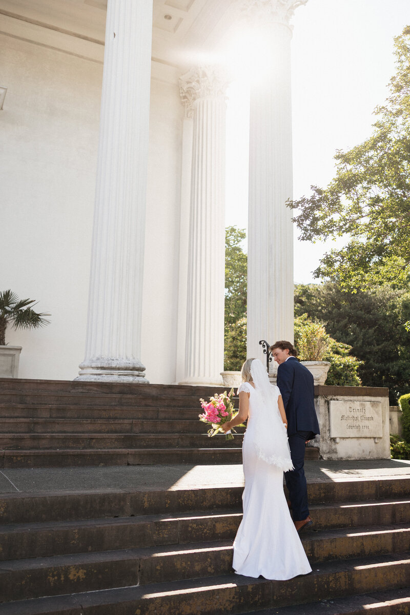 Bride and groom pose during a styled wedding shoot at a photography workshop retreat.