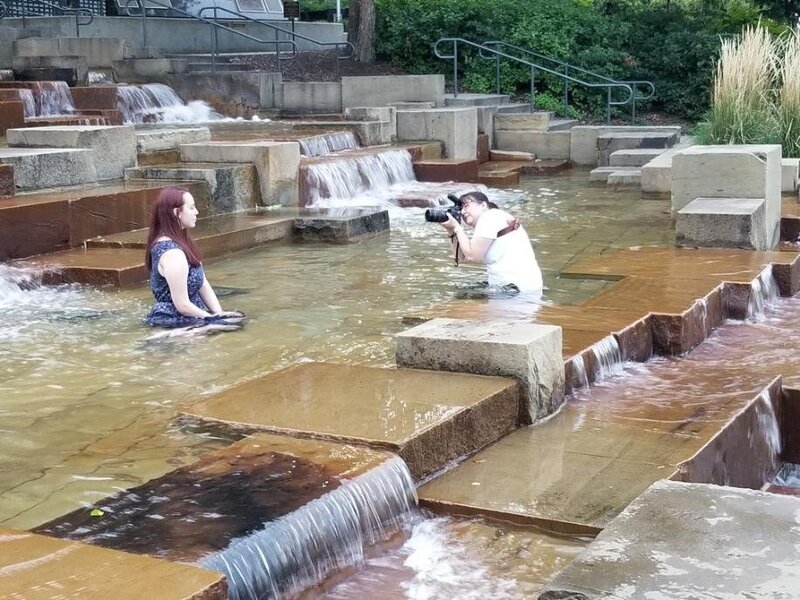 Photo shoot of senior girl sitting in water at Pittsburgh Water Steps
