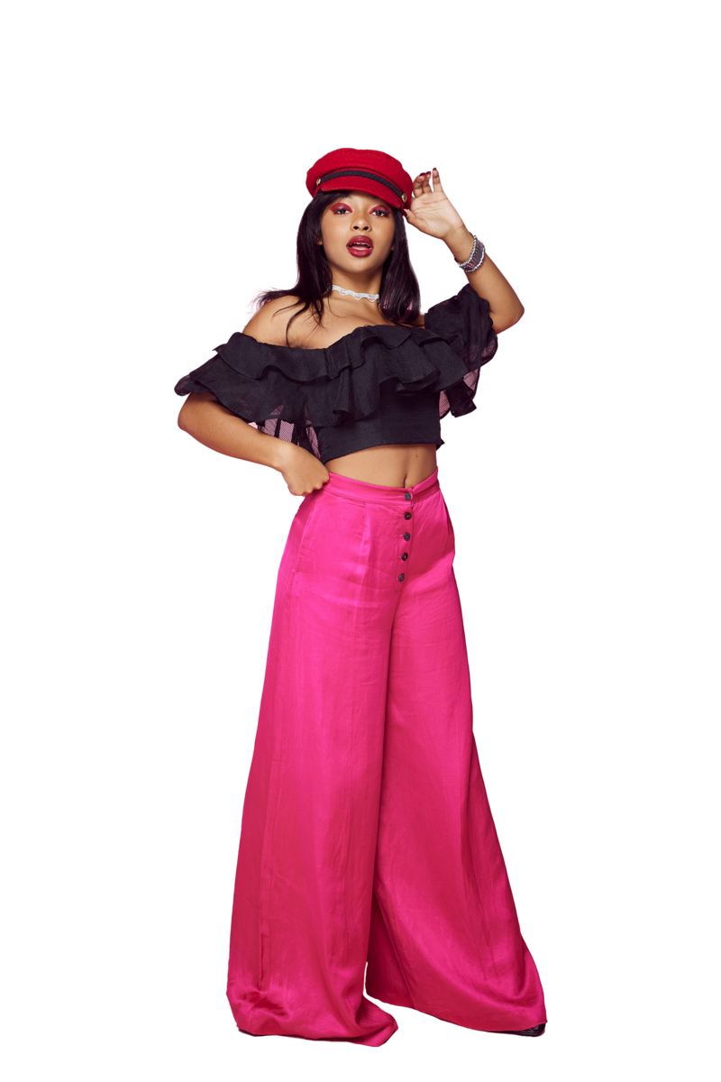 Fashion-inspired senior portraits featuring a stylish girl in red hat and glam makeup against a pink backdrop – LA senior photographer