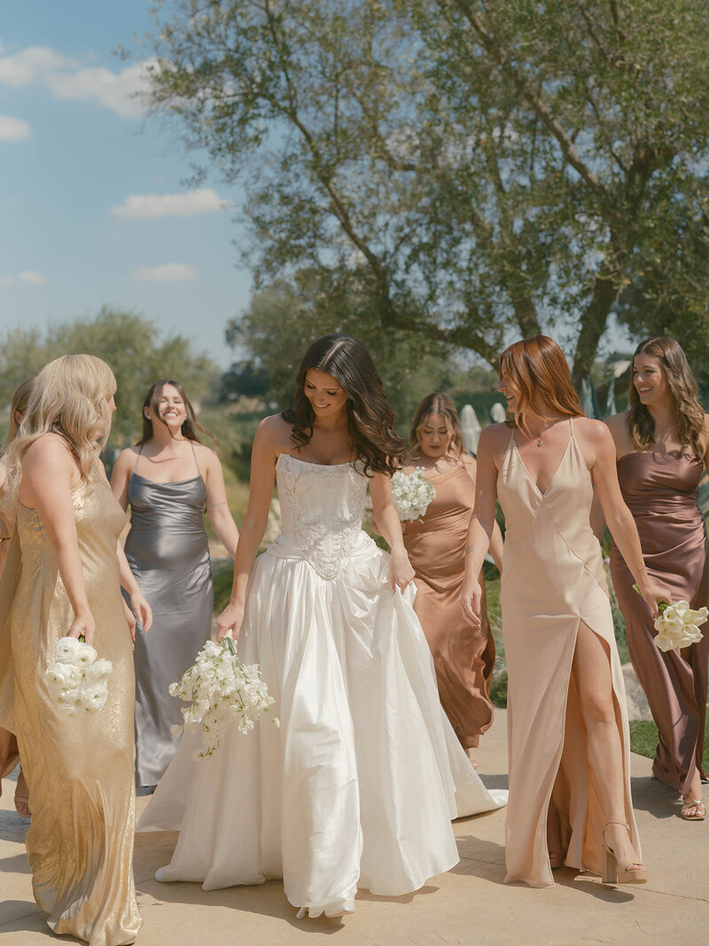 white sweet pea bridal bouquet and modern bride in a corset dress for a wedding at Rava Wines  in Paso Robles by Precious and Blooming 