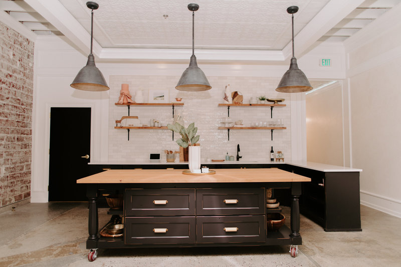 Interior of our studio space with Wood block island with kitchenette