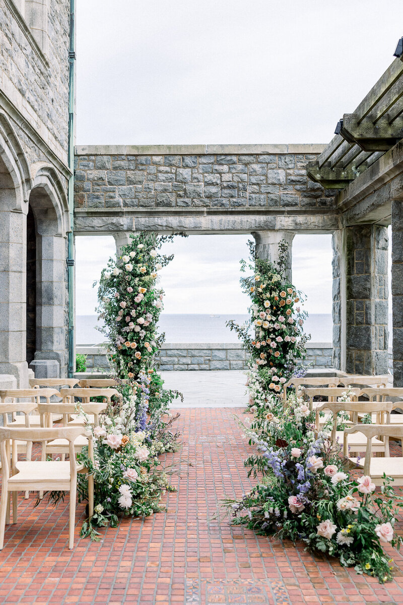 Coastal Wedding Ceremony with lush flowers