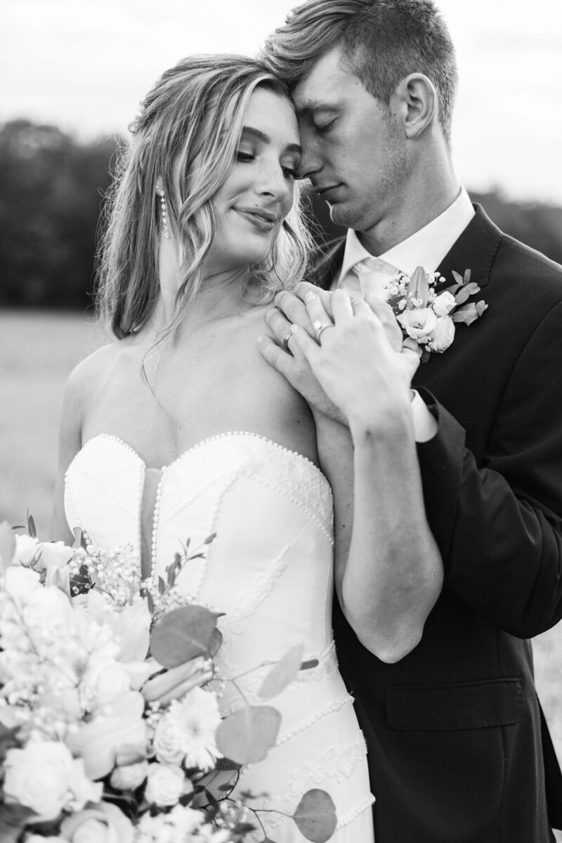Photo of Bride and Groom  embracing taken by Pittsburgh Wedding Photographer, Sara Haines