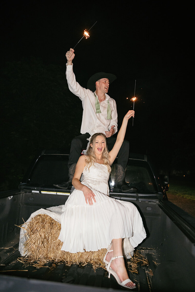 Flash photo of bride and groom in getaway car at Nashville wedding