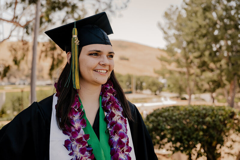 Senior walks towards the camera at sunset