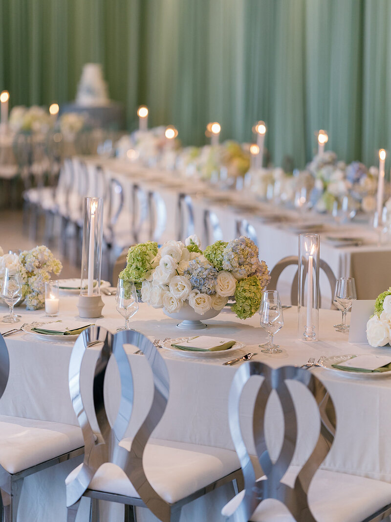 Bride and groom take their wedding vows underneath soft and romantic draped and floral chuppah