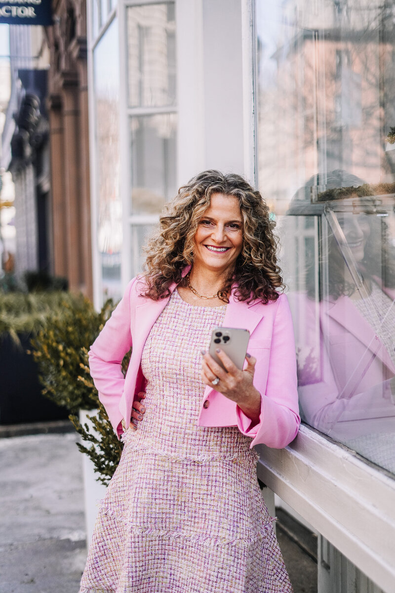 Woman in white shirt sitting outside