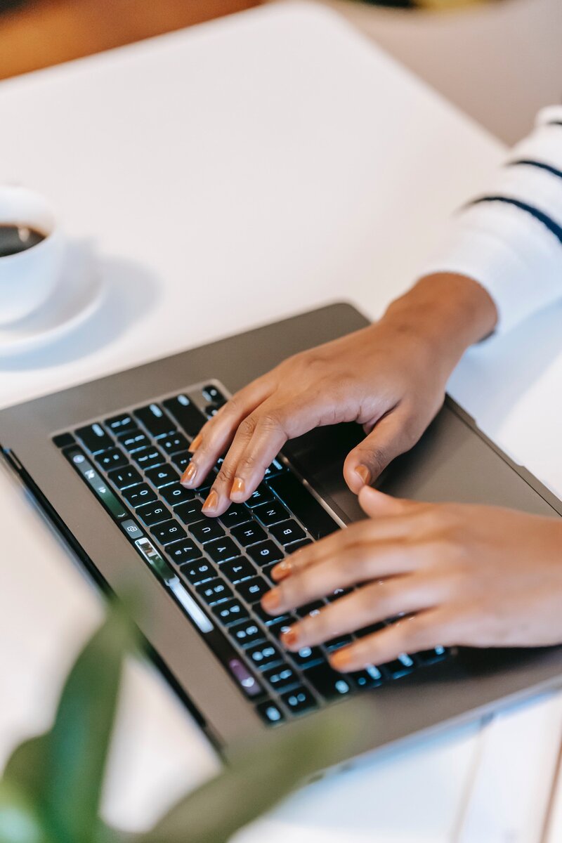 NZ Xero certified Bookkeeper working on laptop