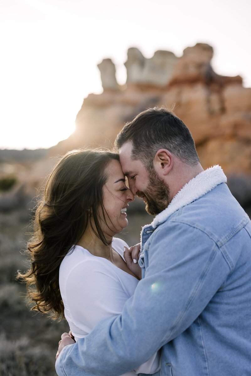 bride and groom laughing during engagement photos