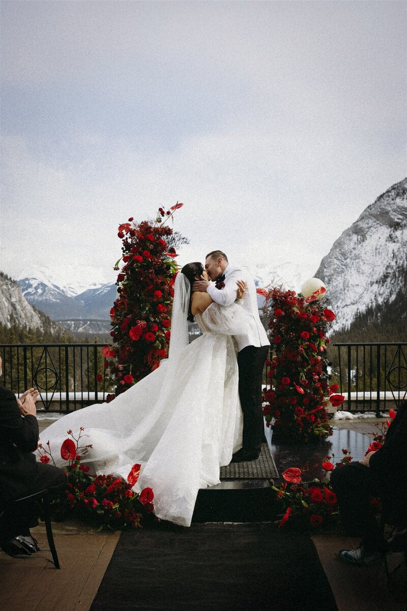 Bride and groom wedding kiss in Banff Springs mountain wedding.