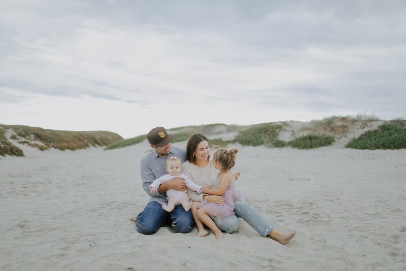 Family photo on the beach of the Heylman family, the owners of Solar Shine San Diego