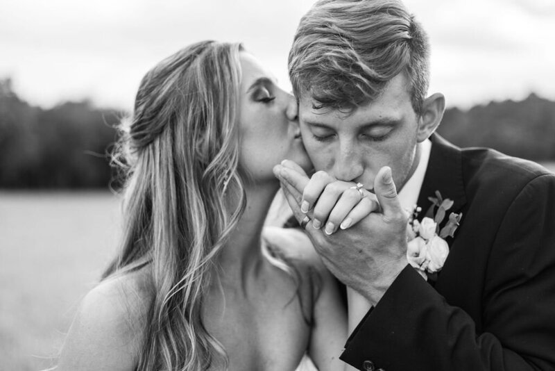Photo of groom kissing bride