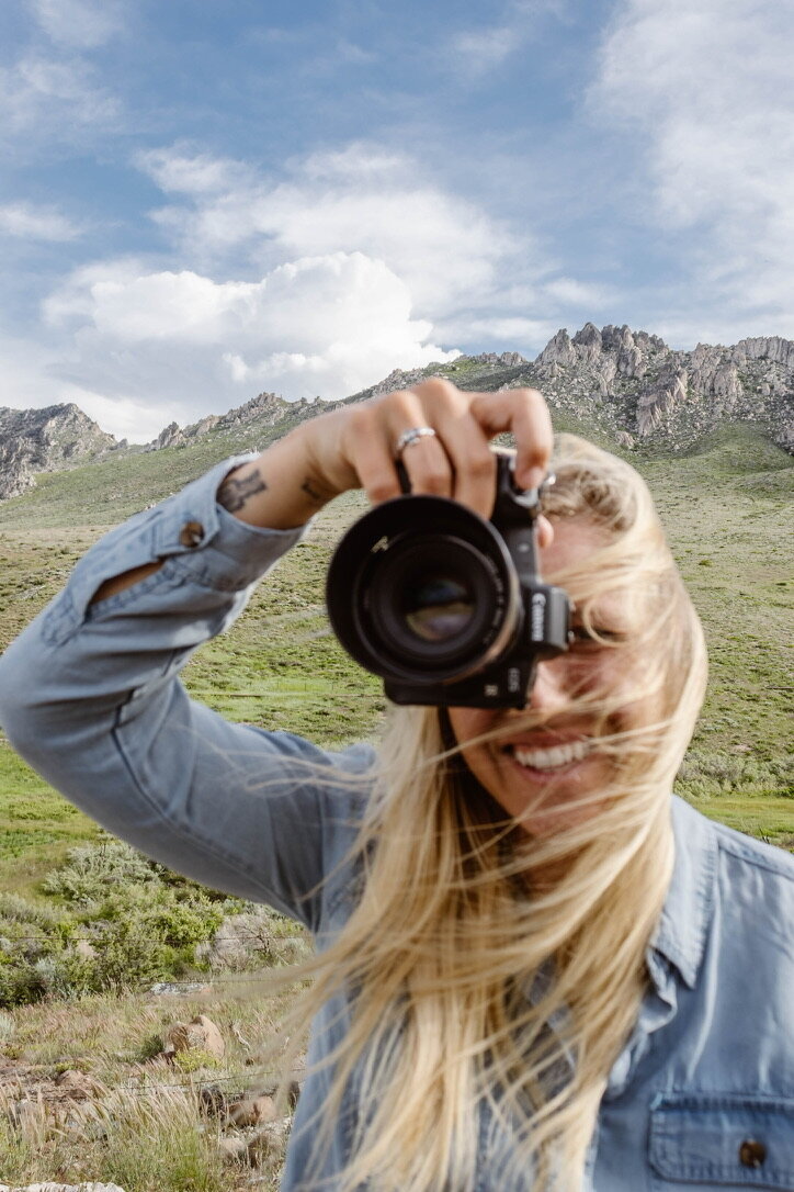Adventurous couple hiking to a mountain overlook during their Lake Tahoe session