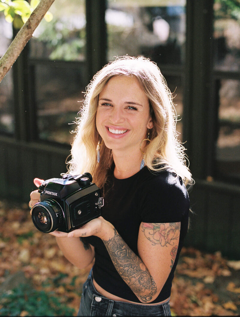 Film photographer in Kentucky holding pentax medium format camera