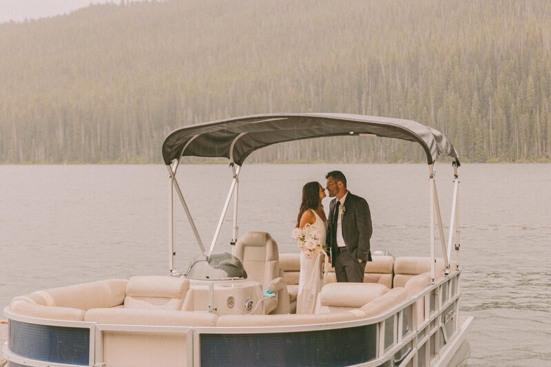 lake elopement kiss captured by Idaho photographer
