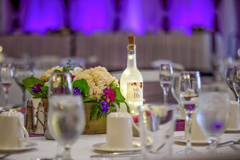 Bottle with twinkle lights used as a reception centerpiece