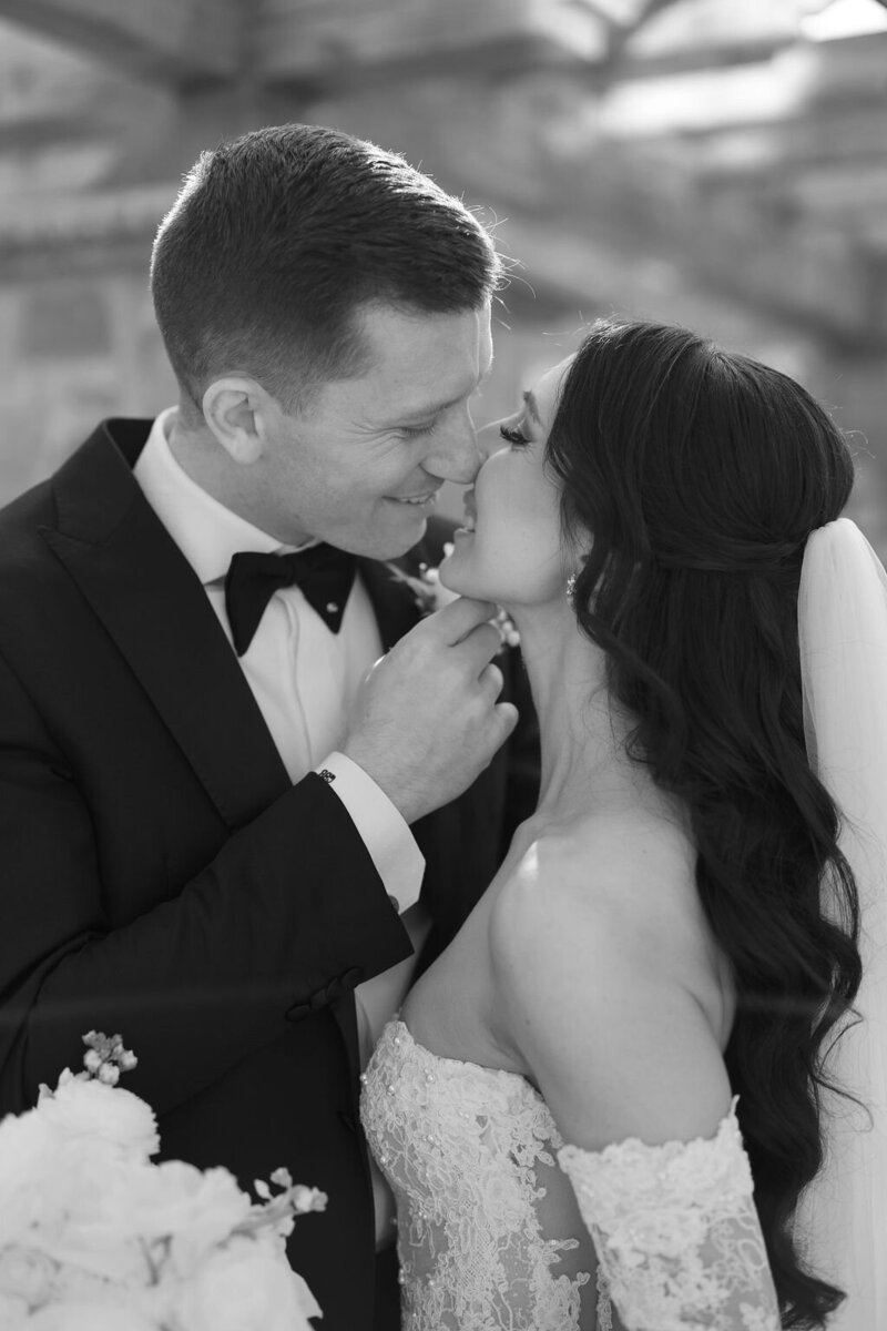 Bride and groom kiss in ceremony at the Hotel Du Village in Pennsylvania