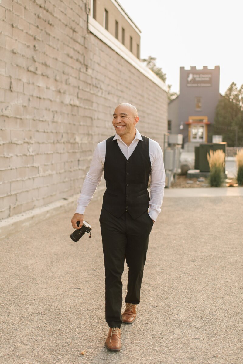 Minneapolis Wedding Videographer Ariel walking with Camera