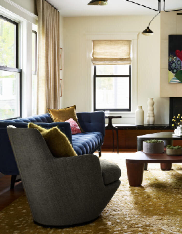 Interior designers in Boston designed a modern mix of furniture for a historic home renovation project in Brookline, MA, blending old and new seamlessly.
