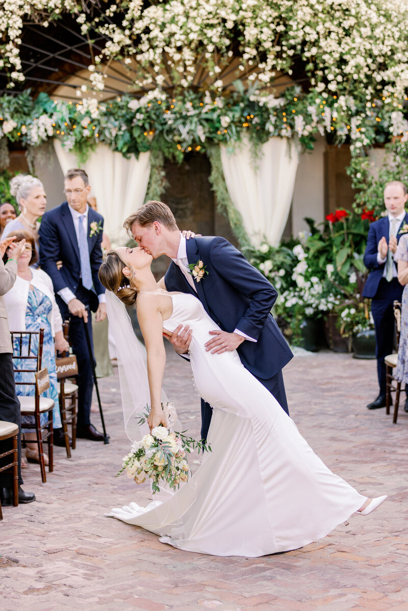 Bride and Groom kiss after exchanging vows at The Stillwell House in Tucson, Arizona
