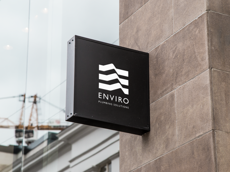 Plumbing company logo on sign