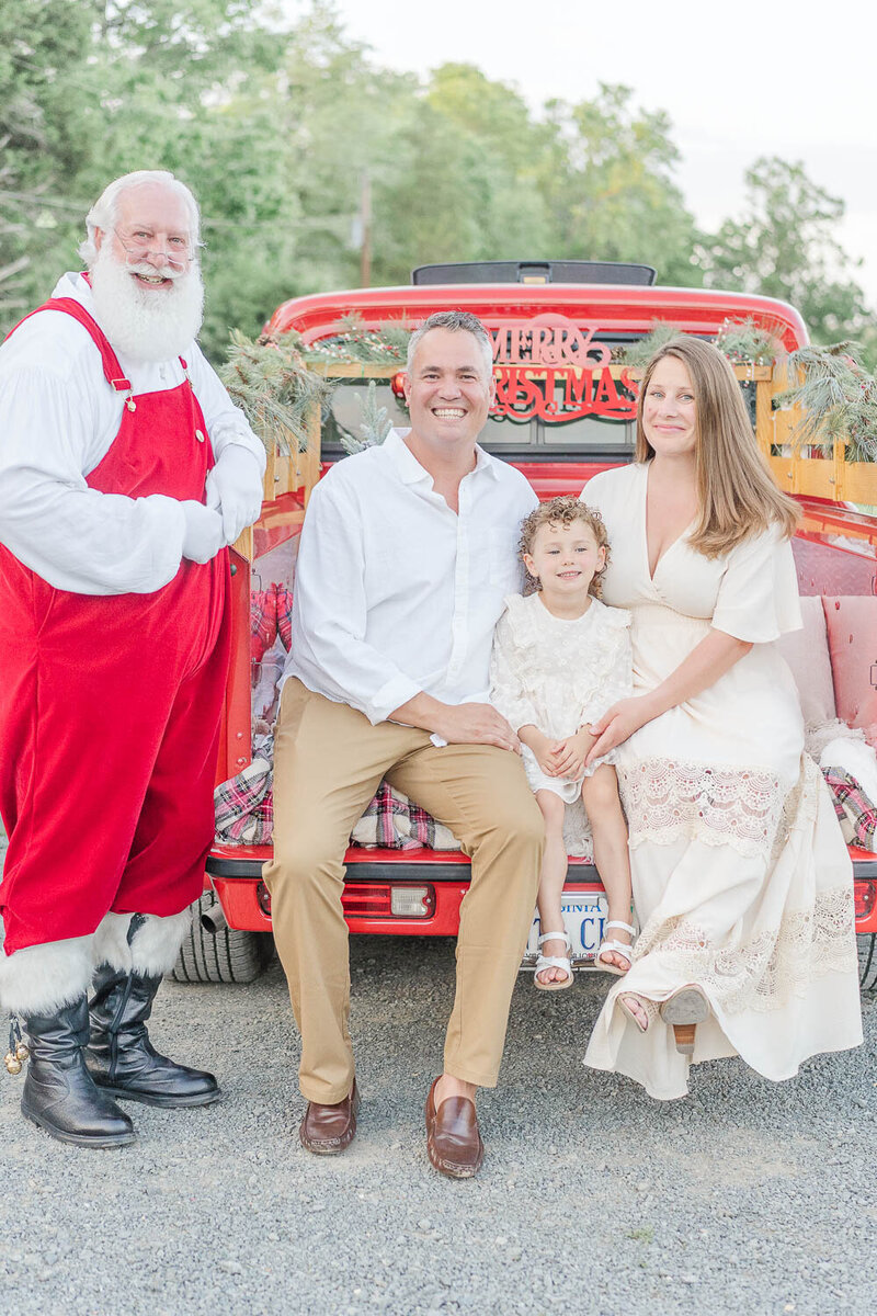 family of 3 photo with Santa during NoVa red truck mini session