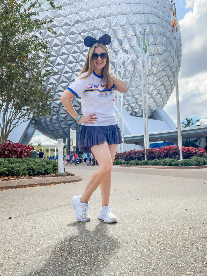 Neyssa Lee standing in front of Magic Kingdom in Walt Disney World