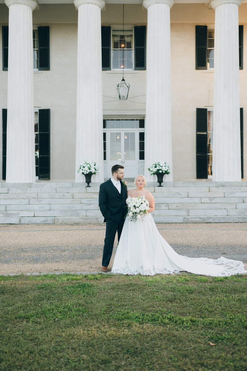 Bride and groom walk up memorial steps at their DC wedding