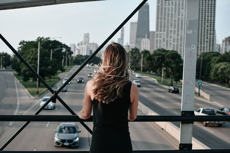 Women entrepreneur working on her laptop, preparing for her Showit website launch. Book a pre-launch polish session to perfect your site before going live