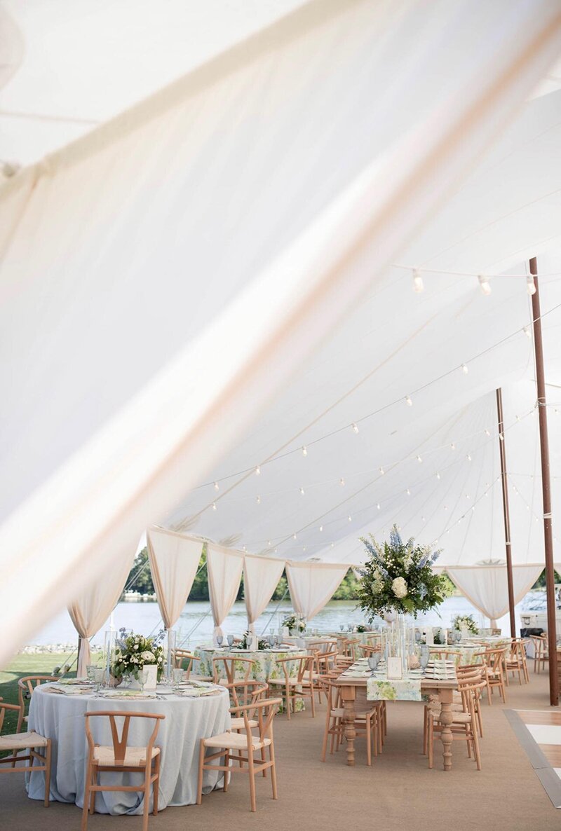 A square pole marquee with seating outside for a pomo event