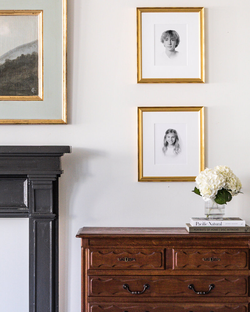 Two matted framed prints on wall delivered in Caroline Eidson's client's home