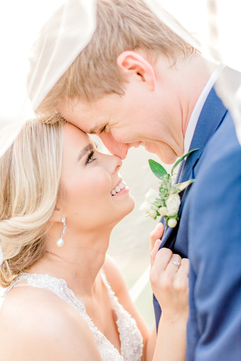 picture of a bride and groom embracing and touching noses taken by Huntsville AL   Wedding Photographer Emily McIntyre Photography