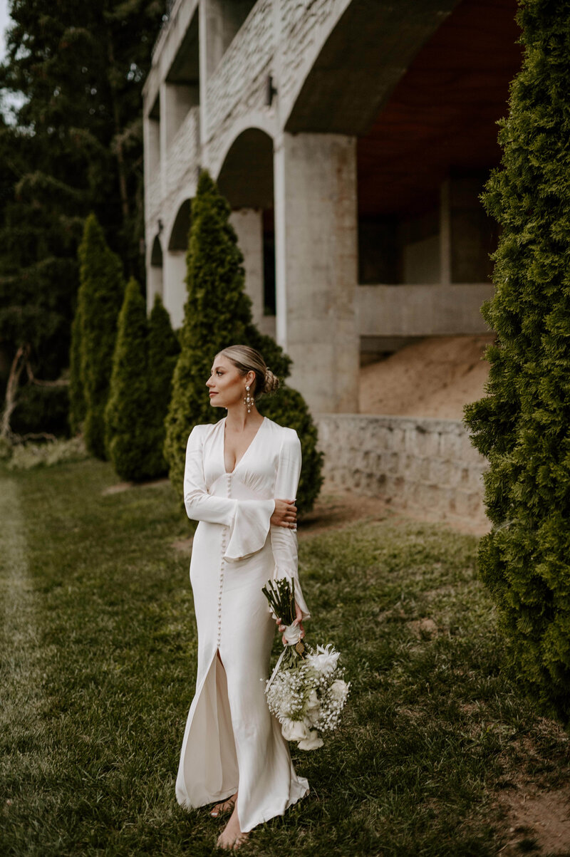 bride in a classic white gown holding her bouquet