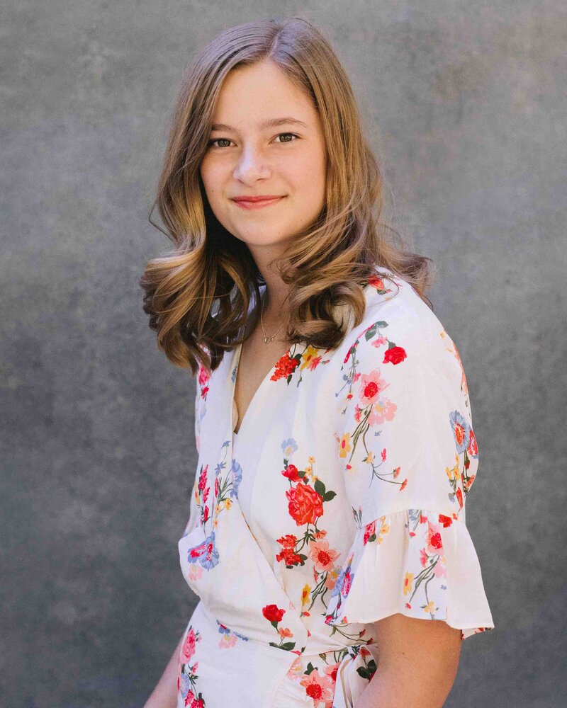 Teen in white dress  with flowers by California portrait photographer