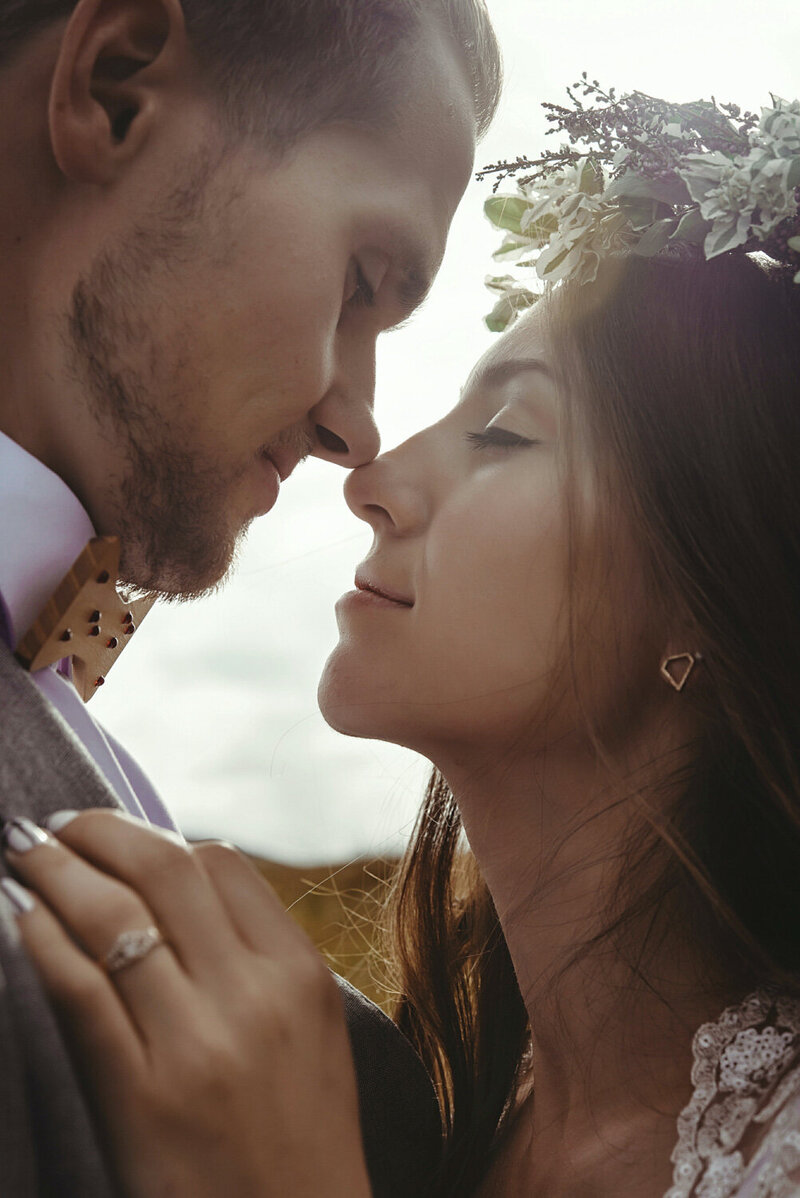 Couple about to kiss with closed eyes