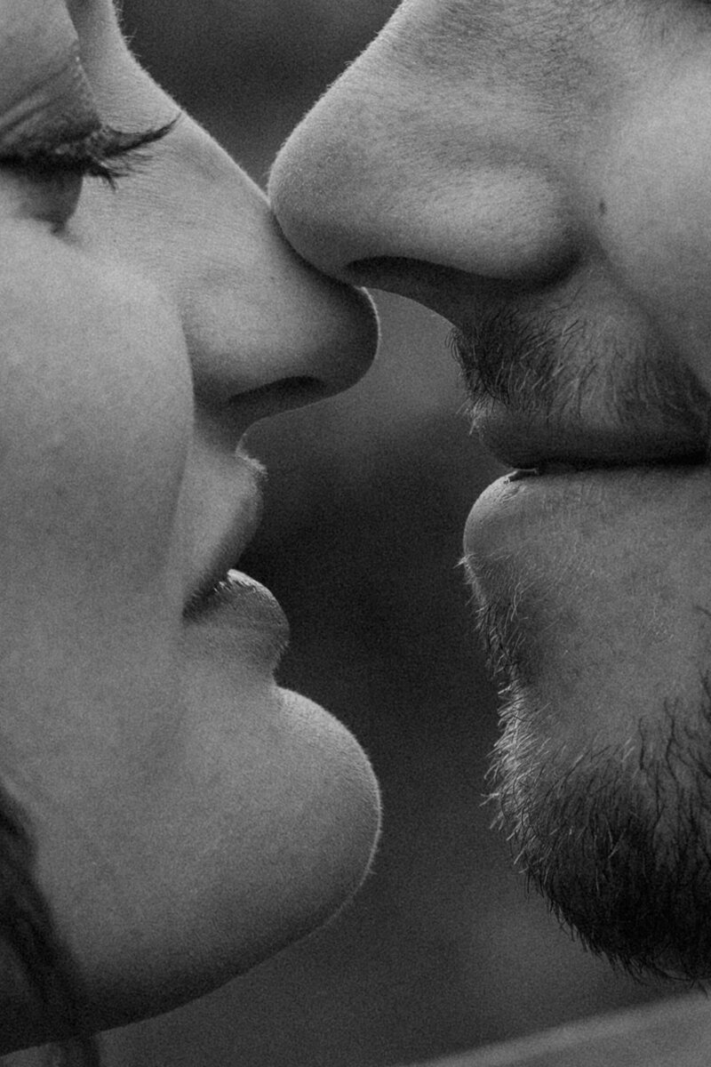 close up of the mouths and noses of a couple almost kissing