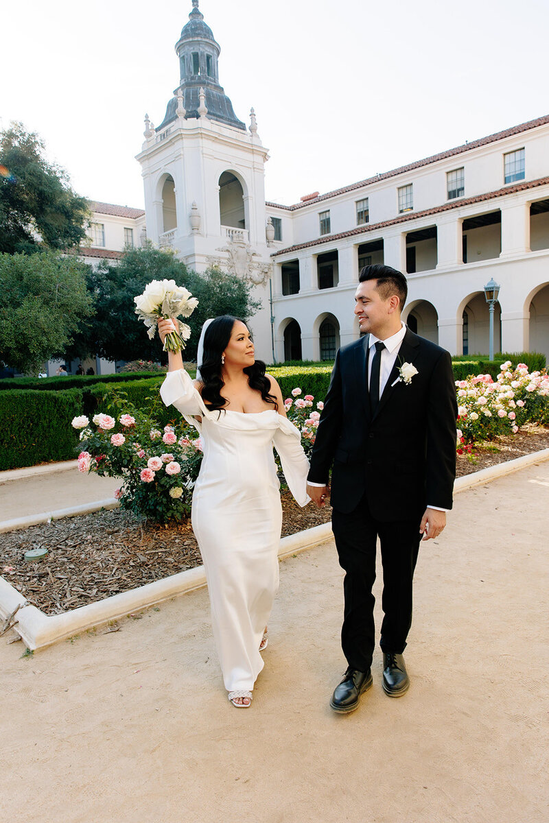couple laughing together at their long beach wedding
