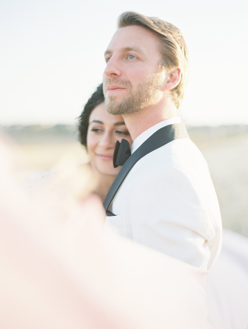 Portrait of bride and groom hugging after intimate elopement in Colorado