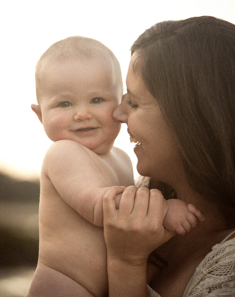 Candid family photography session at Terrigal Beach capturing laughter and connection