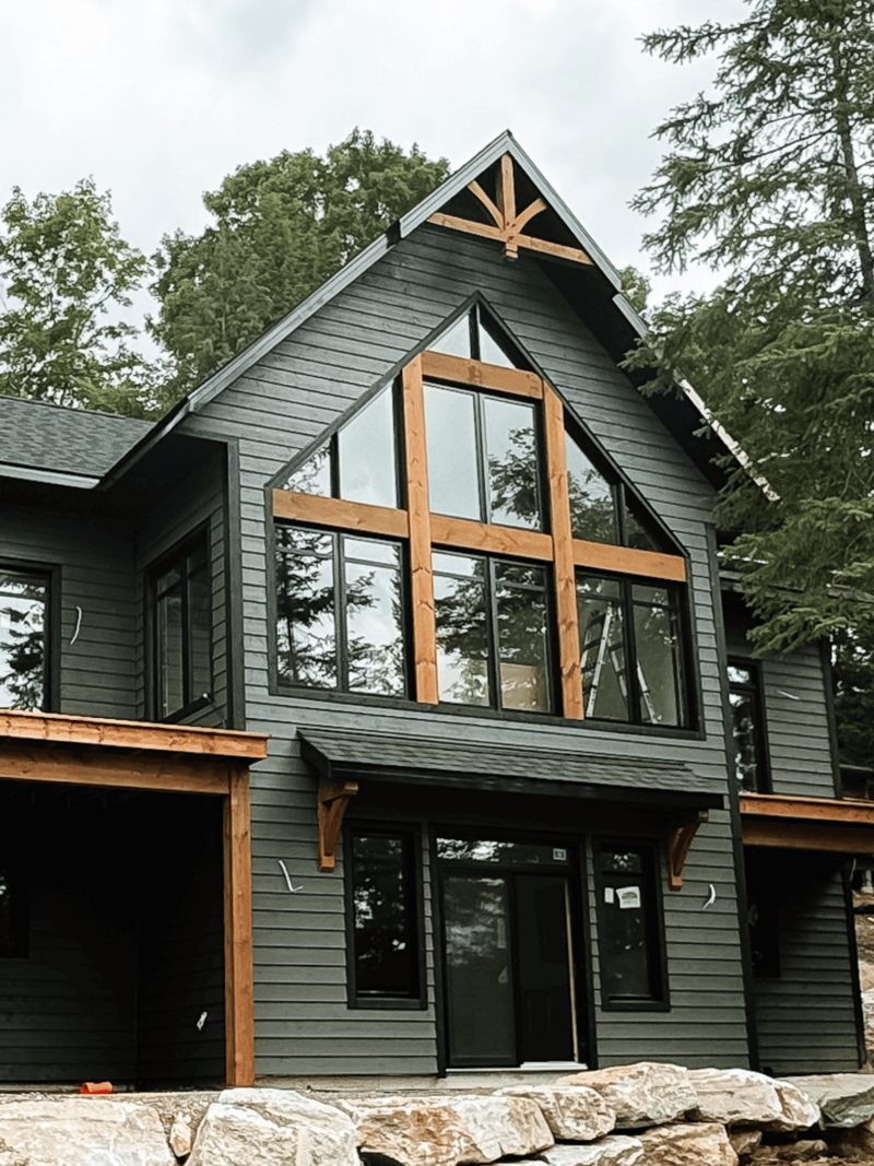 Custom timber frame home build in Haliburton Highlands showcasing expert craftsmanship and luxury natural materials.