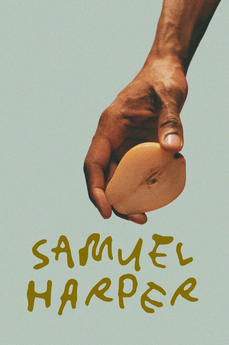 a hand holding a halved pear with the logo for samuel harper
