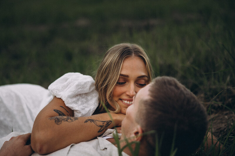 Luxury skincare brand photography featuring two women on the beach, holding facial serums in golden sunlight. Natural and storytelling brand photography for beauty and wellness brands, captured on the Sunshine Coast.