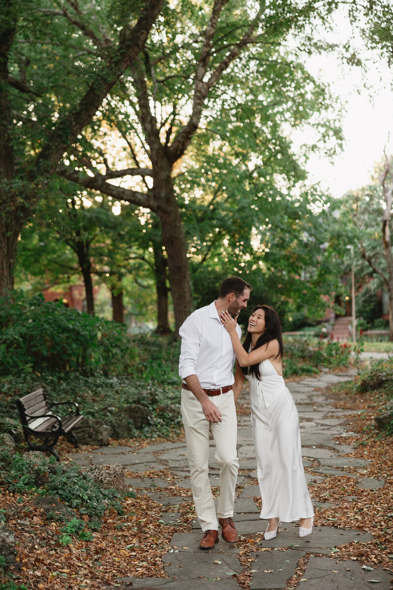 Bride and groom walking in front of St. Louis Art Museum