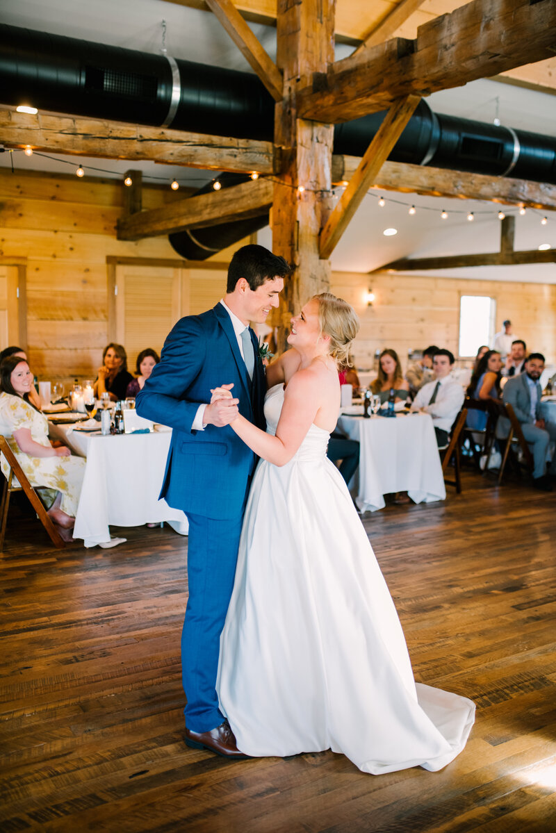 Couple share their first dance on the dance floor