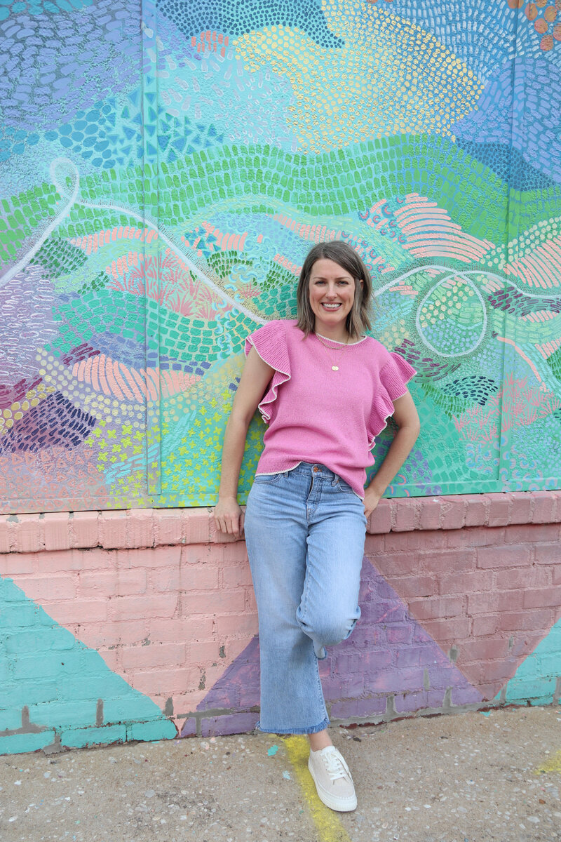 Woman against colorful wall