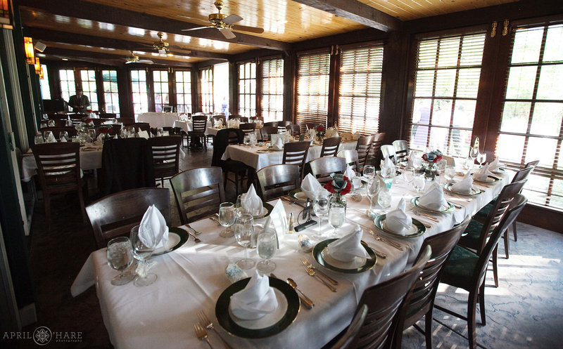 Tables set up inside the Sunroom at Greenbriar Inn Boulder CO