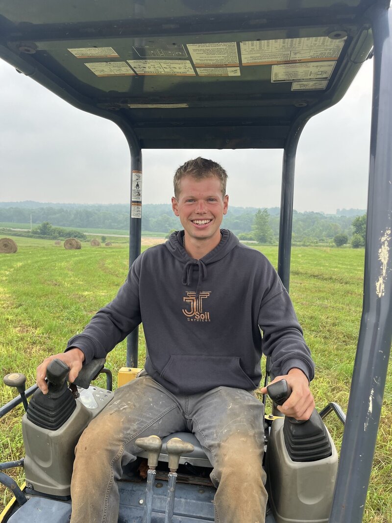 Joe operating a skid steer.
