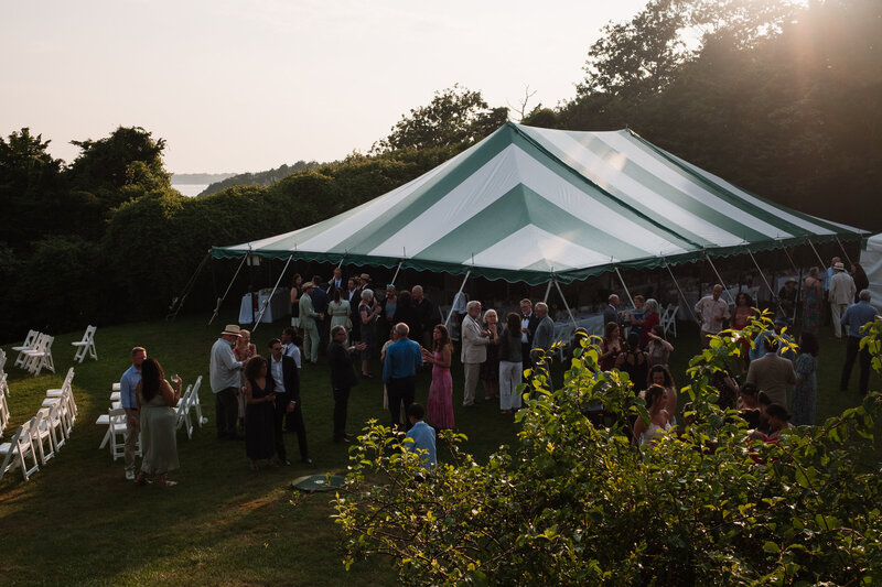 Tent and guests at coastal New England wedding