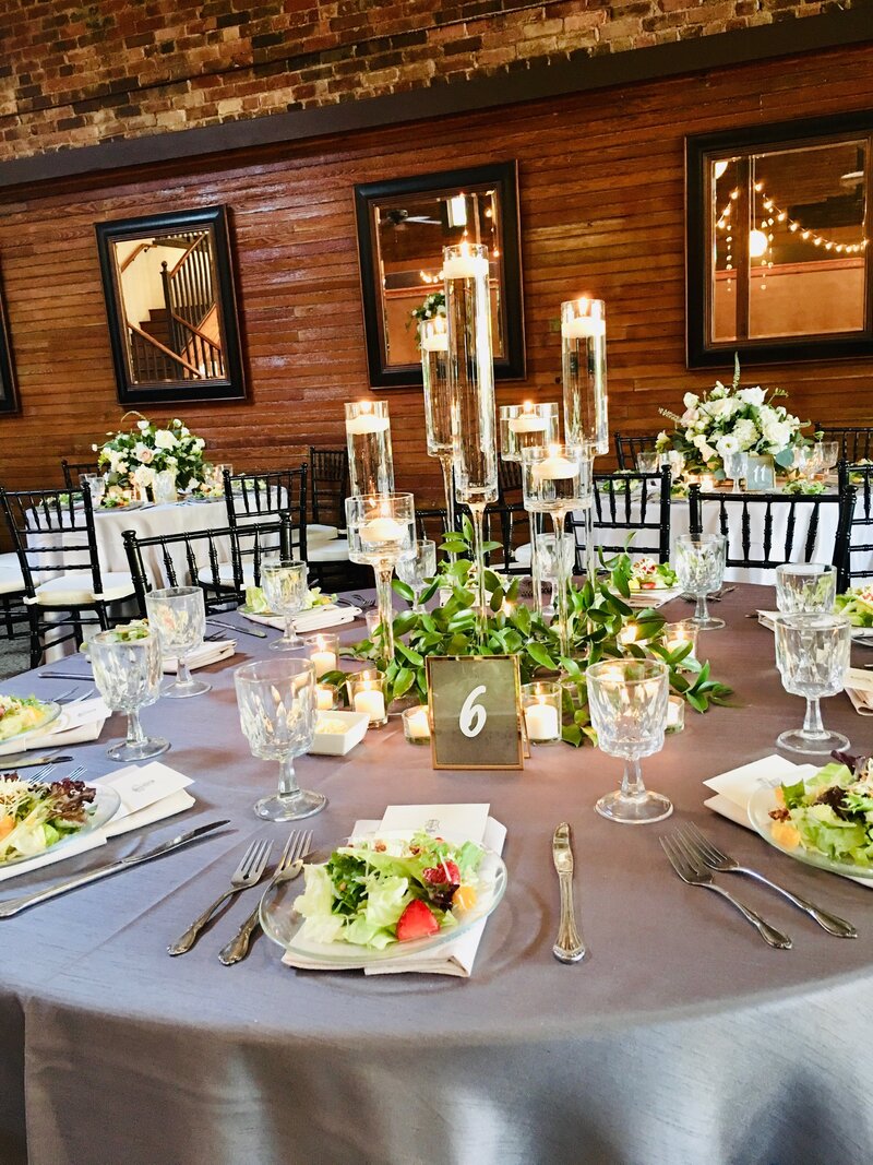 Venue Dining Room Table with Gray tones in Velvet for Guest Table at Palafox Wharf Waterfront Venue in Pensacola FL