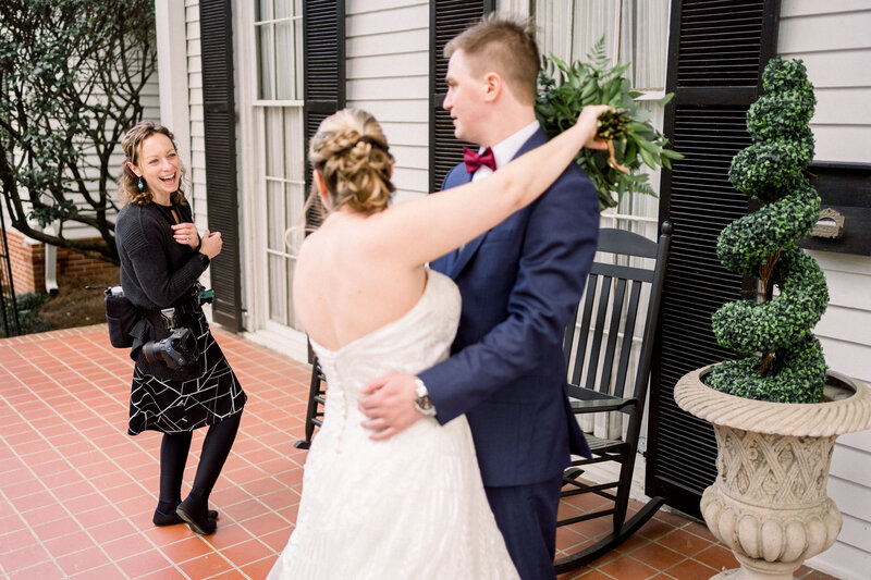 Wedding Photographer in Atlanta fist bumping at work